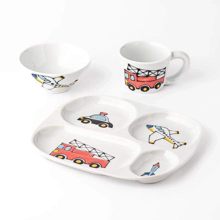 White ceramic kids mug, plate, and rice bowl set featuring fire truck, police car, airplane, and rocket graphics