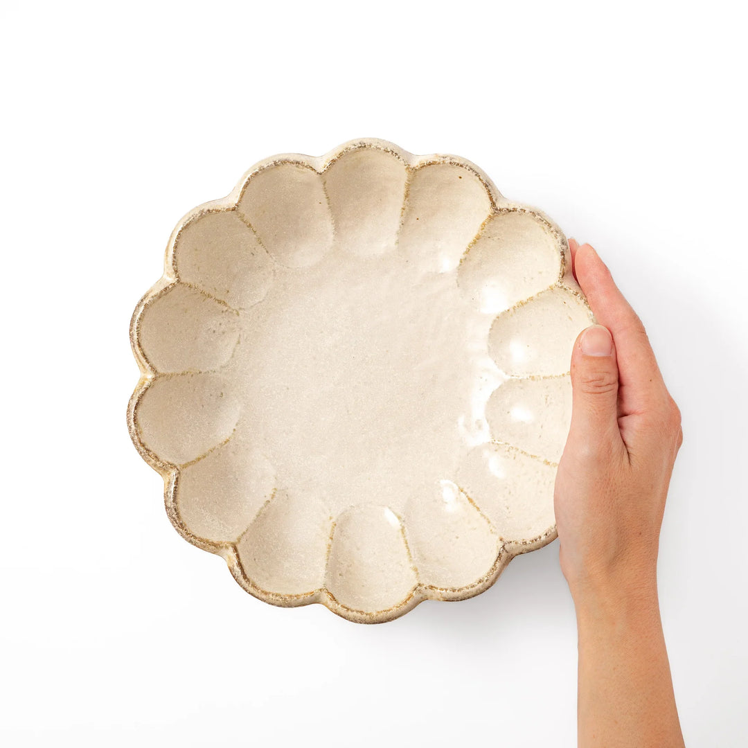 Japanese Rinka ceramic petal pasta bowl in off white, featuring a flower shaped rim and shallow depth for noodles
