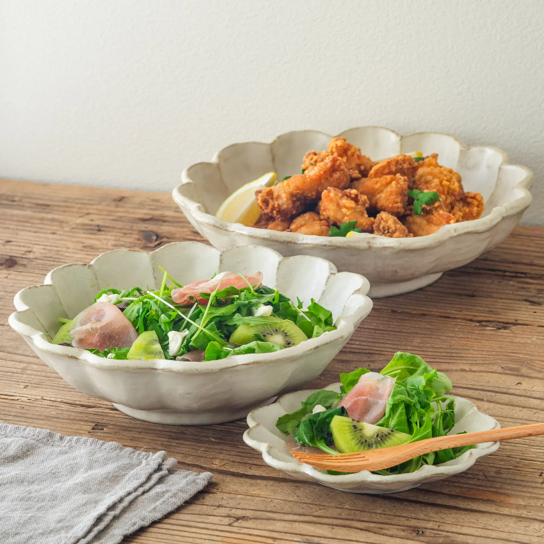 Japanese Rinka Petal Pasta Bowls holding fresh salad and crispy fried chicken served on a rustic table