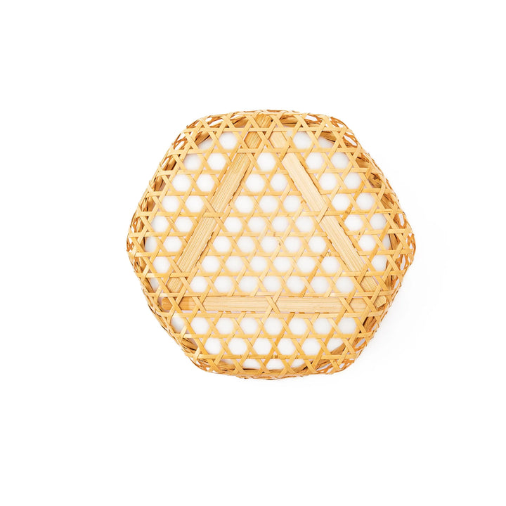 An open round handwoven bamboo serving basket with its hexagonal mesh pattern lid leaning slightly to the side