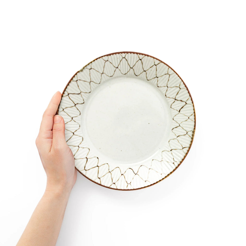 Rustic diamond weave ceramic salad plate shown held in hand