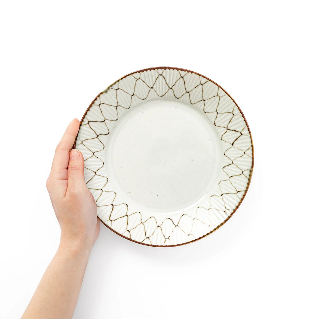 Rustic diamond weave ceramic salad plate shown held in hand