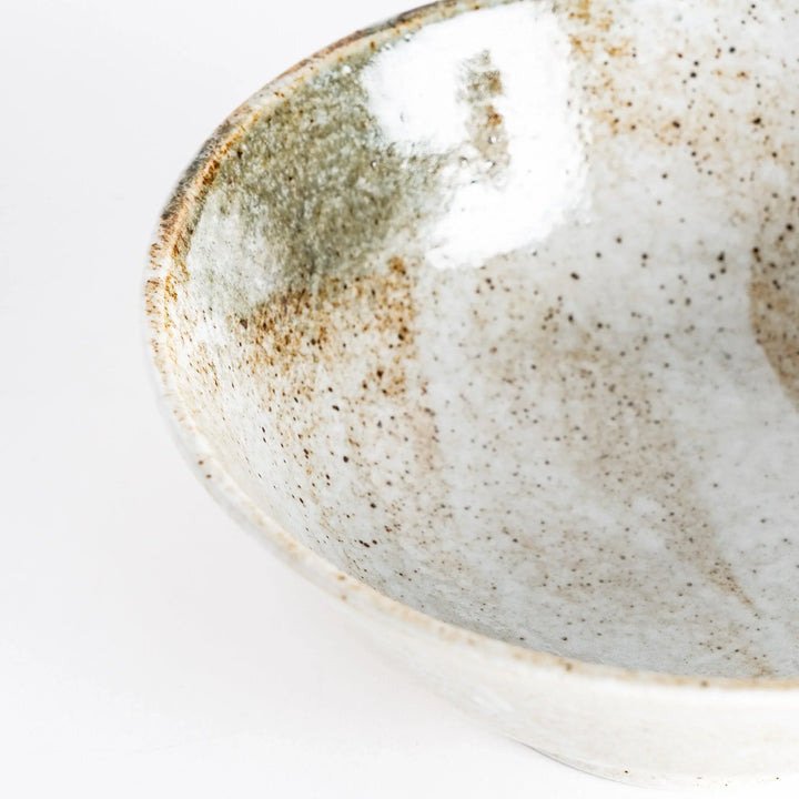 Close-up view showing the rim of the rustic earth-tone ramen bowl with a glossy finish and earthy textures.