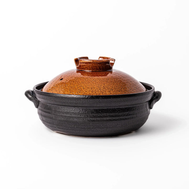 Japanese donabe clay pot with brown glazed lid and black base induction compatible for 2 to 3 person hot pot.