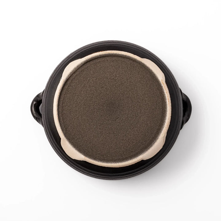 Japanese donabe clay pot with brown glazed lid and black base induction compatible for 2 to 3 person hot pot.