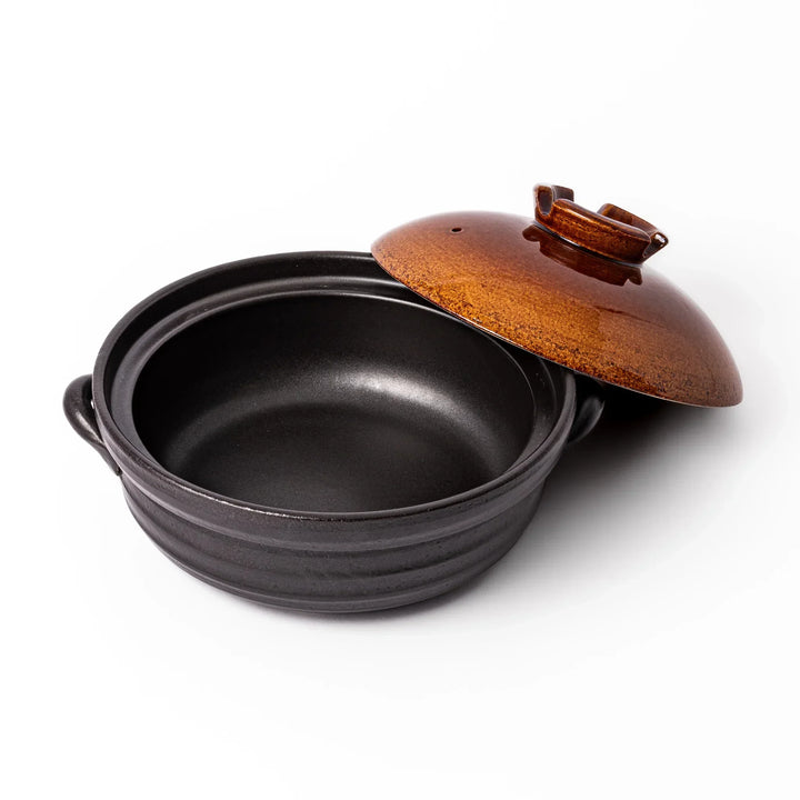 Japanese donabe clay pot with brown glazed lid and black base induction compatible for family hot pot.