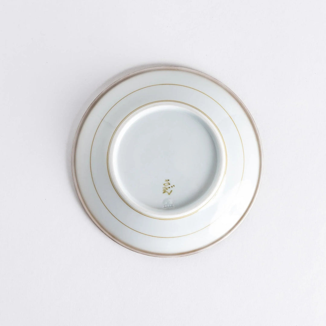 A round white dessert plate with a rustic scallop-edged border. The border comes in blue, brown, and olive.