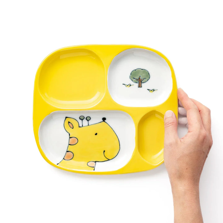 White ceramic kids divided plate with smiling yellow giraffe, tree and bird motifs, vibrant yellow sections