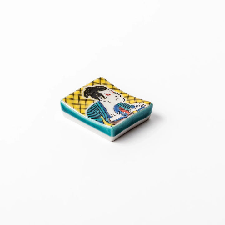 Rectangular Japanese ceramic chopstick rest with kabuki actor design inspired by Sharaku ukiyoe art.