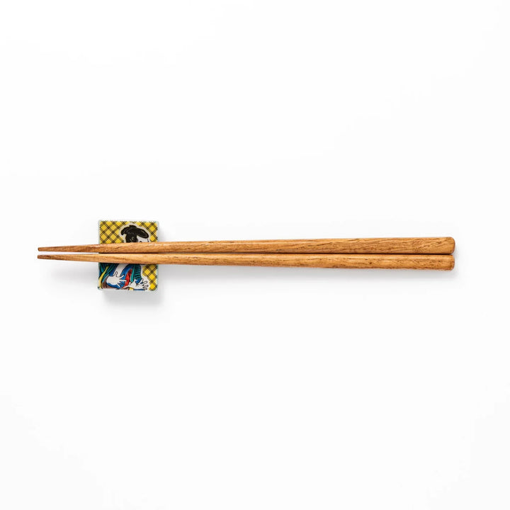 Rectangular Japanese ceramic chopstick rest with kabuki actor design inspired by Sharaku ukiyoe art.