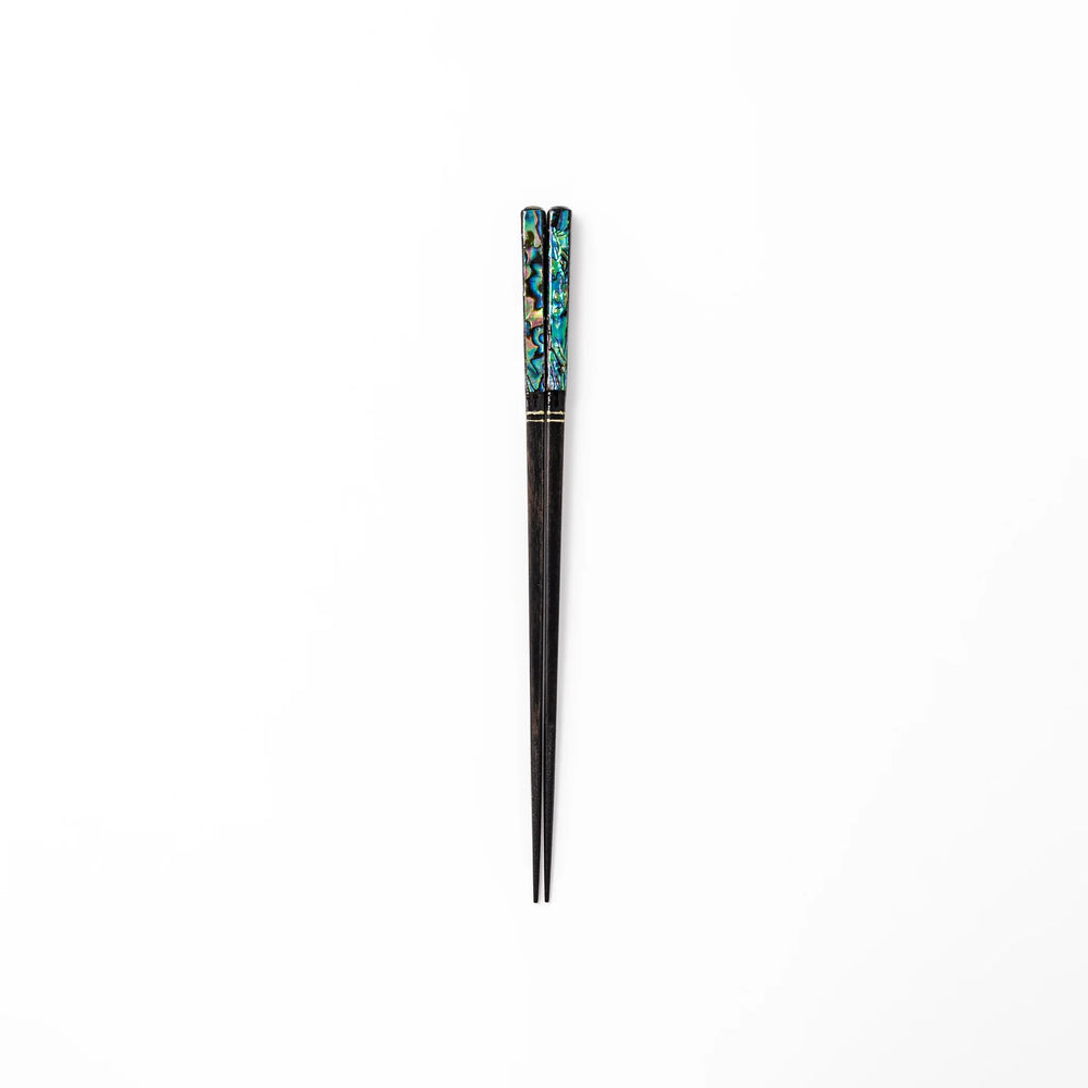 Japanese black lacquer chopsticks with shimmering abalone shell inlay, handcrafted for refined and elegant dining.