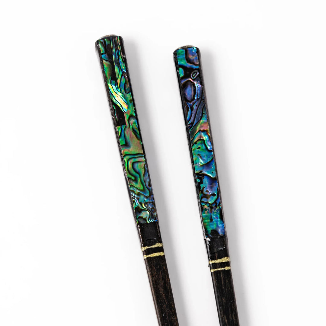 Japanese black lacquer chopsticks with shimmering abalone shell inlay, handcrafted for refined and elegant dining.