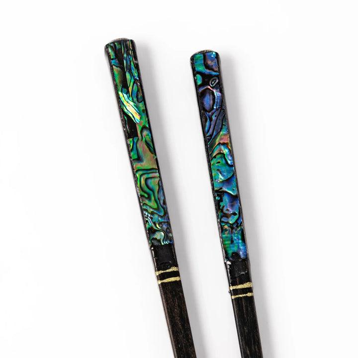 Japanese black lacquer chopsticks with shimmering abalone shell inlay, handcrafted for refined and elegant dining.