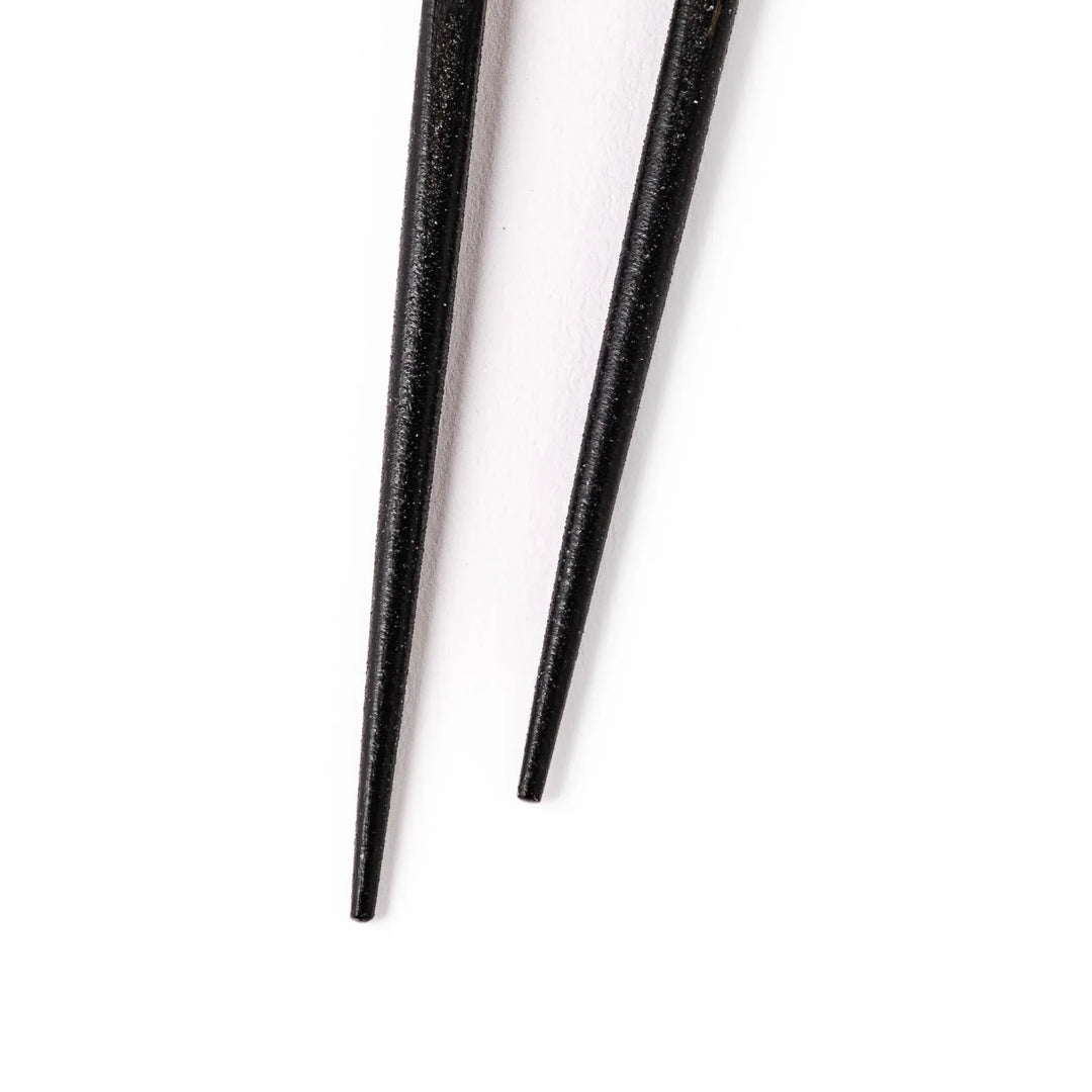 Japanese black lacquer chopsticks with shimmering abalone shell inlay, handcrafted for refined and elegant dining.