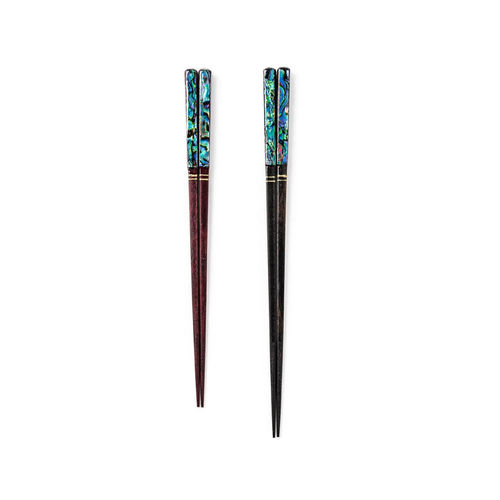 Japanese lacquer chopsticks in red and black with shimmering abalone shell inlay, handcrafted with elegant glossy finish.