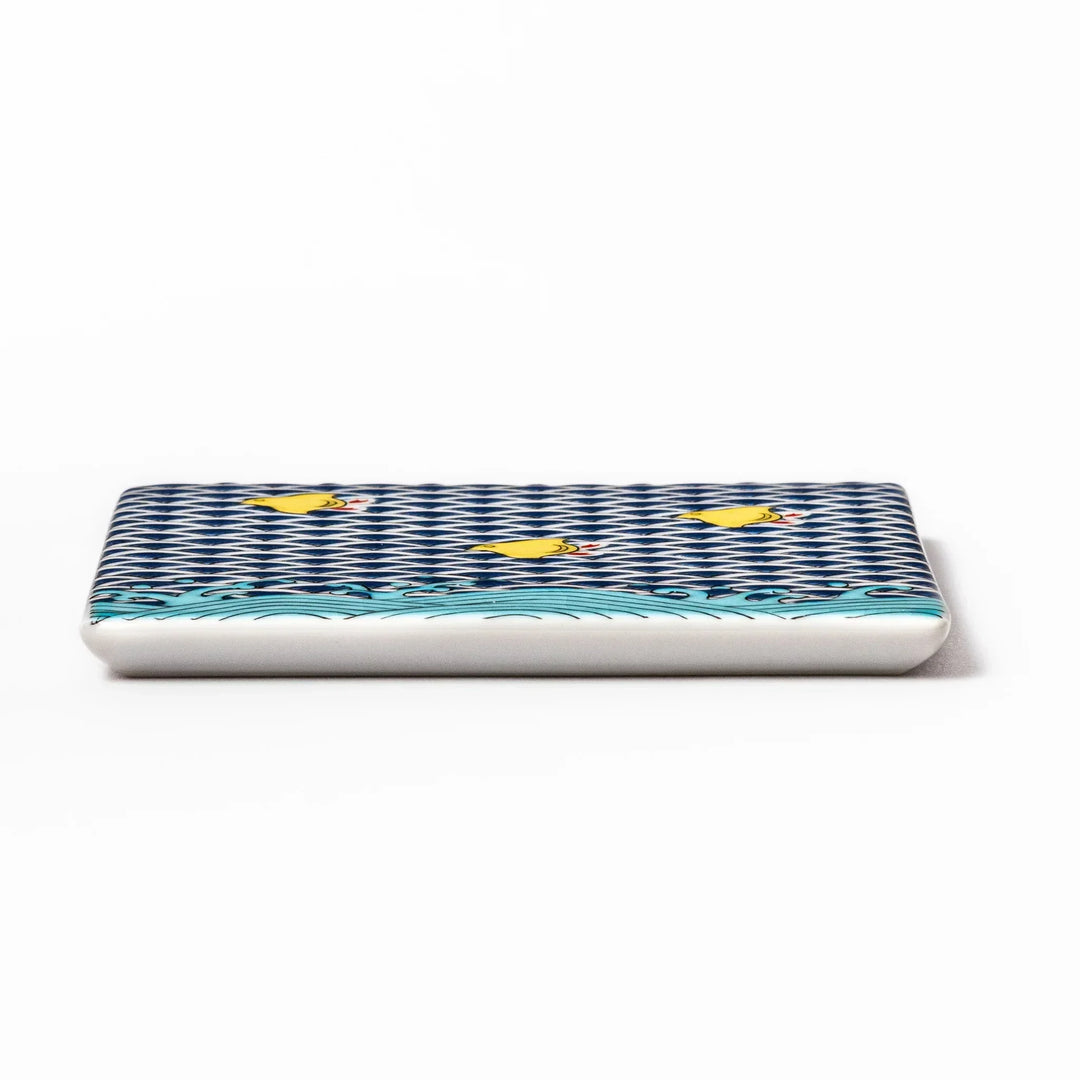 Square Japanese ceramic coaster with blue wave pattern and yellow shorebirds for artistic stylish dining.