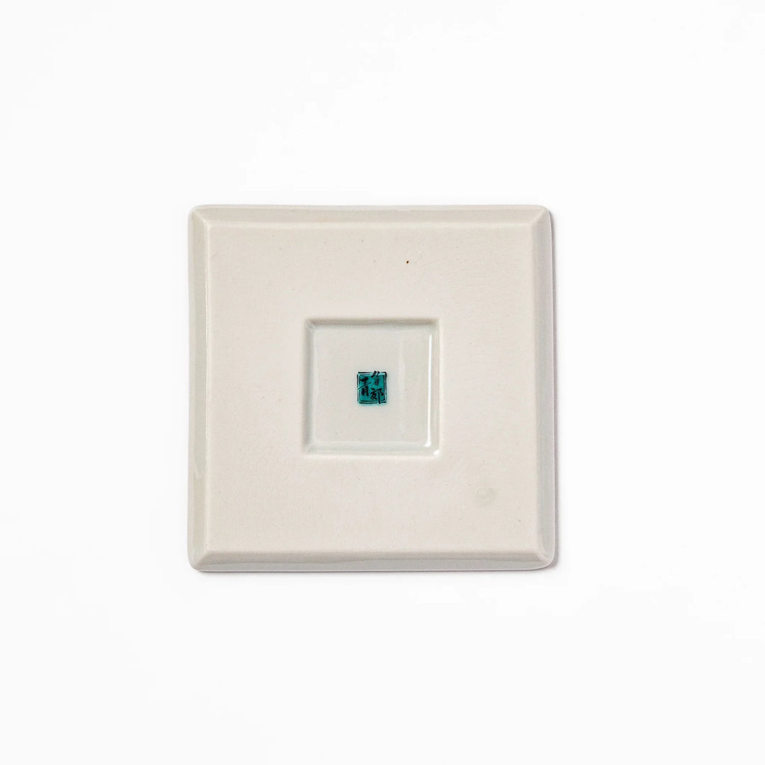 Square Japanese ceramic coaster with blue wave pattern and yellow shorebirds for artistic stylish dining.