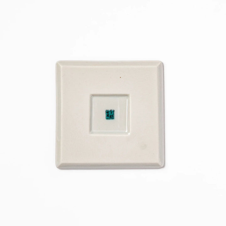 Square Japanese ceramic coaster with blue wave pattern and yellow shorebirds for artistic stylish dining.