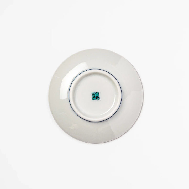 Round Japanese ceramic sauce dish with blue wave pattern and yellow shorebirds for soy sauce or condiments.