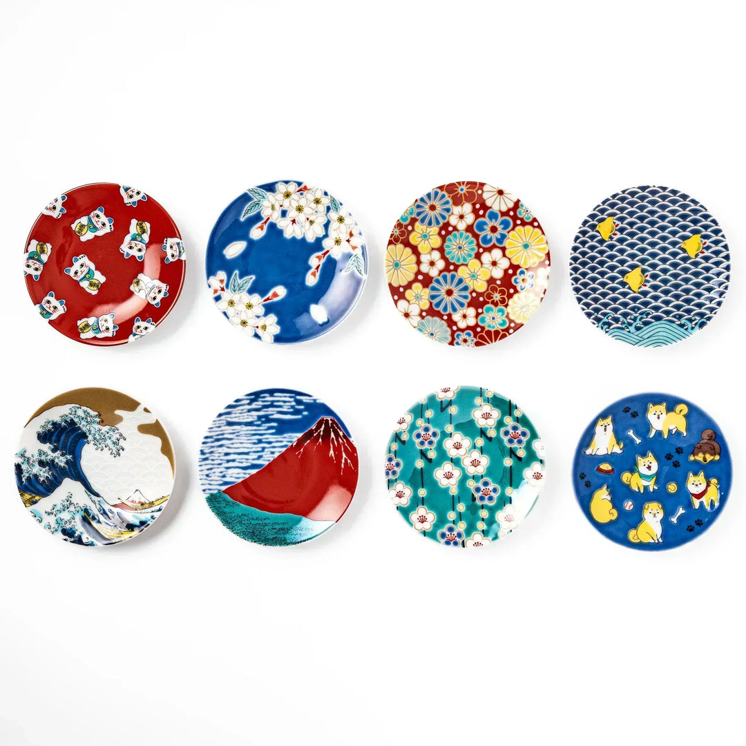 Round Japanese ceramic sauce dish featuring traditional motifs like waves Mt Fuji cherry blossoms and shiba dogs.