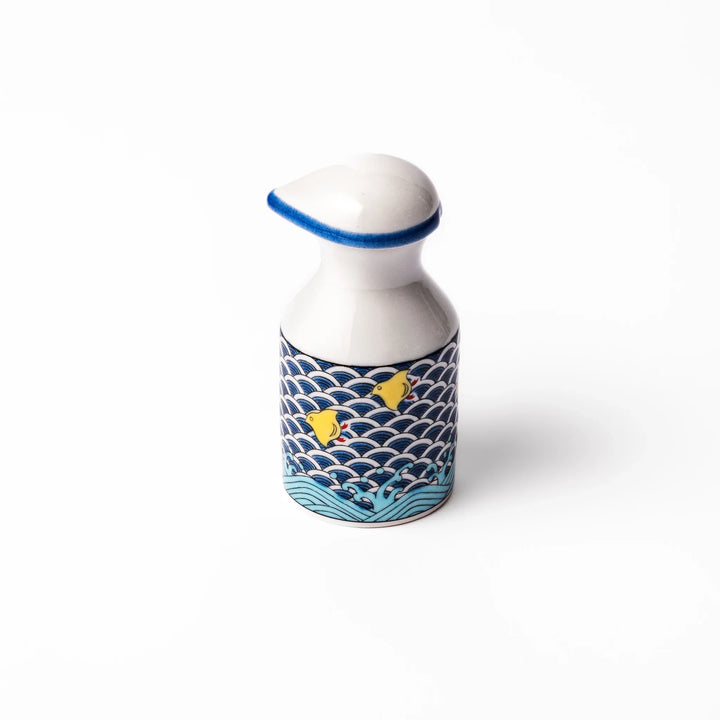 Japanese ceramic soy sauce dispenser with blue wave pattern and yellow shorebirds for traditional dining.