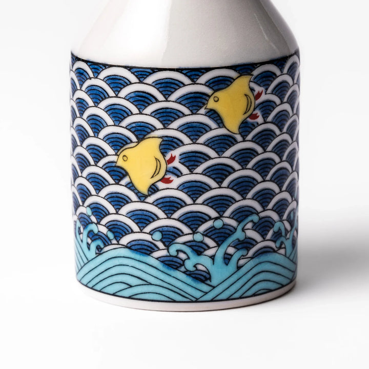 Japanese ceramic soy sauce dispenser with blue wave pattern and yellow shorebirds for traditional dining.