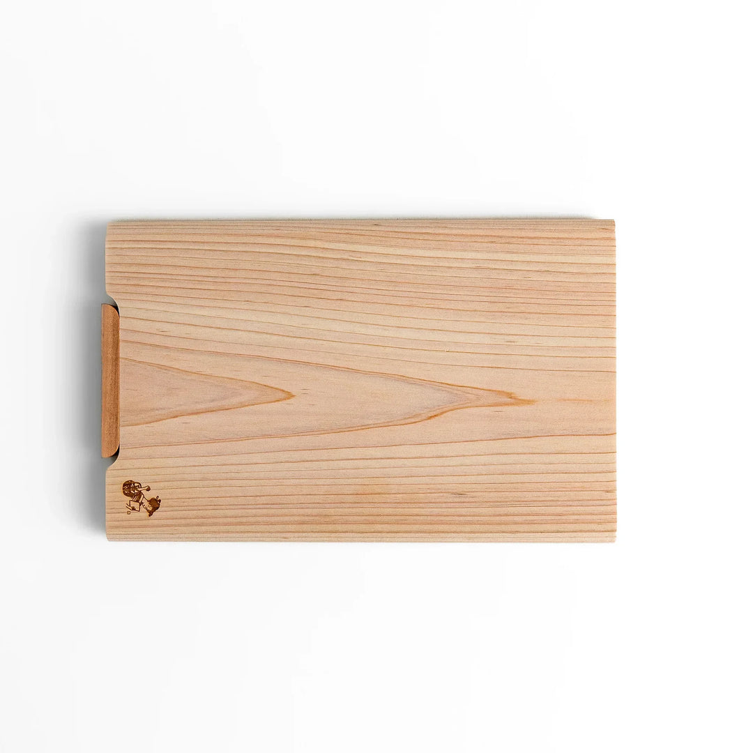 Small Hinoki wood cutting board with smooth grain, natural finish, corner handle, and engraved motif, crafted in Japan