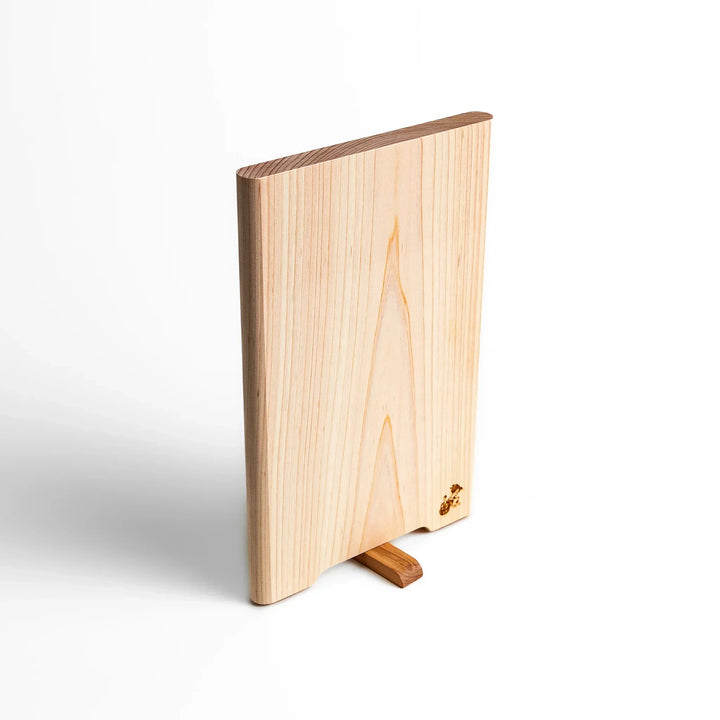 Small Hinoki wood cutting board with smooth grain, natural finish, corner handle, and engraved motif, crafted in Japan