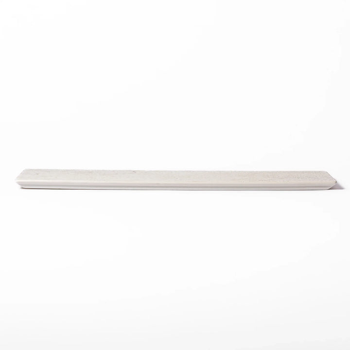 Rectangular white Japanese ceramic serving plate with ridged texture and matte gloss contrast for dining.