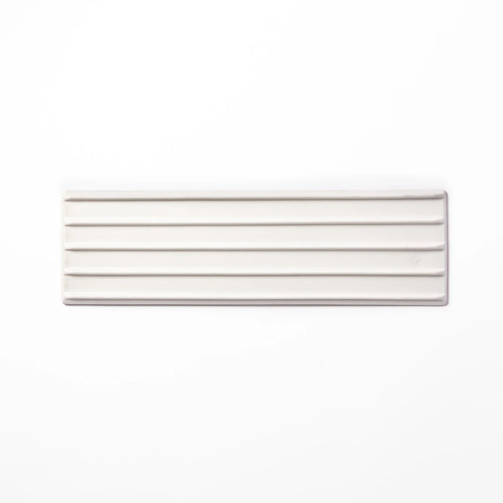 Rectangular white Japanese ceramic serving plate with ridged texture and matte gloss contrast for dining.