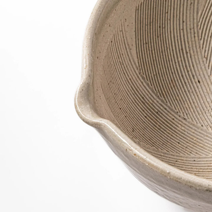 Soft sage-colored mortar with a speckled Hiwa glaze and grooved interior, perfect for grinding sesame or spices.