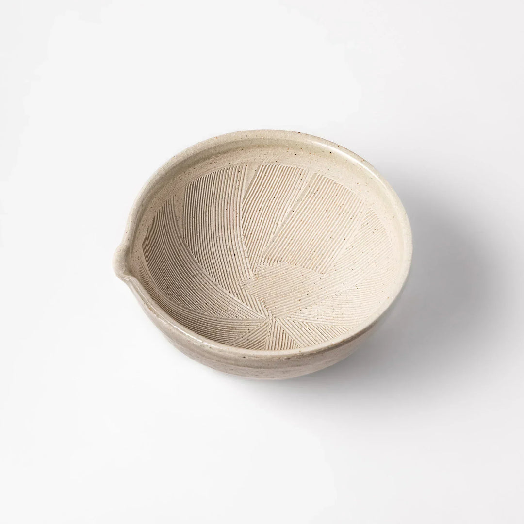 Soft sage-colored mortar with a speckled Hiwa glaze and grooved interior, perfect for grinding sesame or spices.