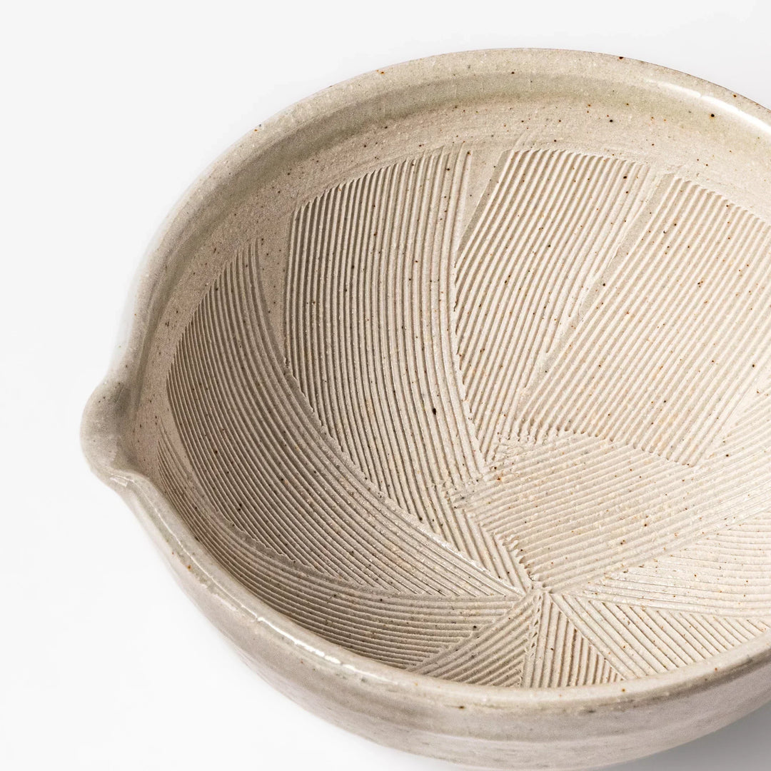 Soft sage-colored mortar with a speckled Hiwa glaze and grooved interior, perfect for grinding sesame or spices.