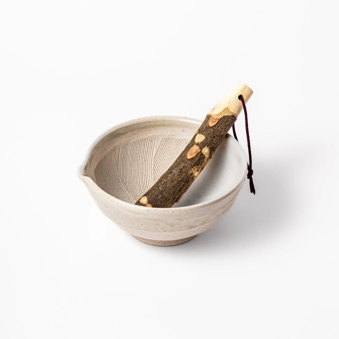 Soft sage-colored mortar with a speckled Hiwa glaze, paired with a natural wood pestle—ideal for grinding sesame or spices.