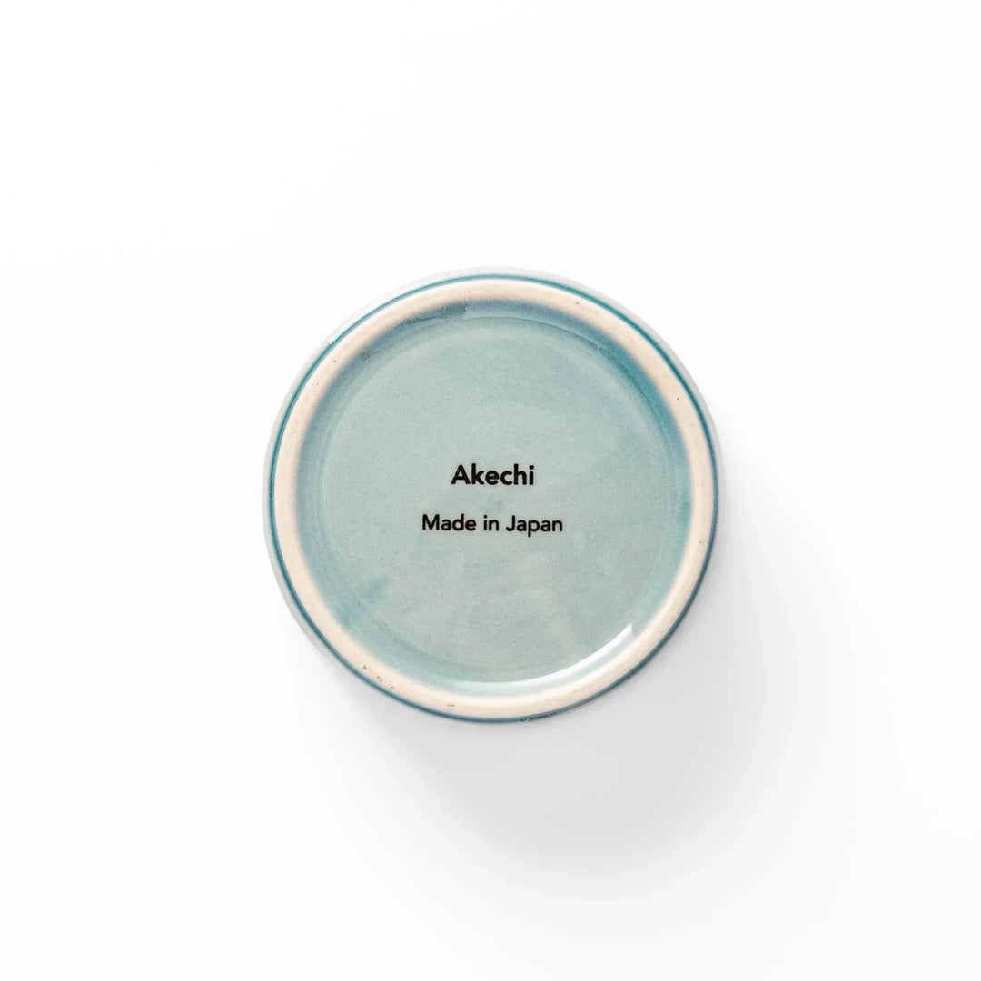 Light blue stackable Japanese porcelain bowl with embossed Seigaiha wave pattern and smooth matte texture.