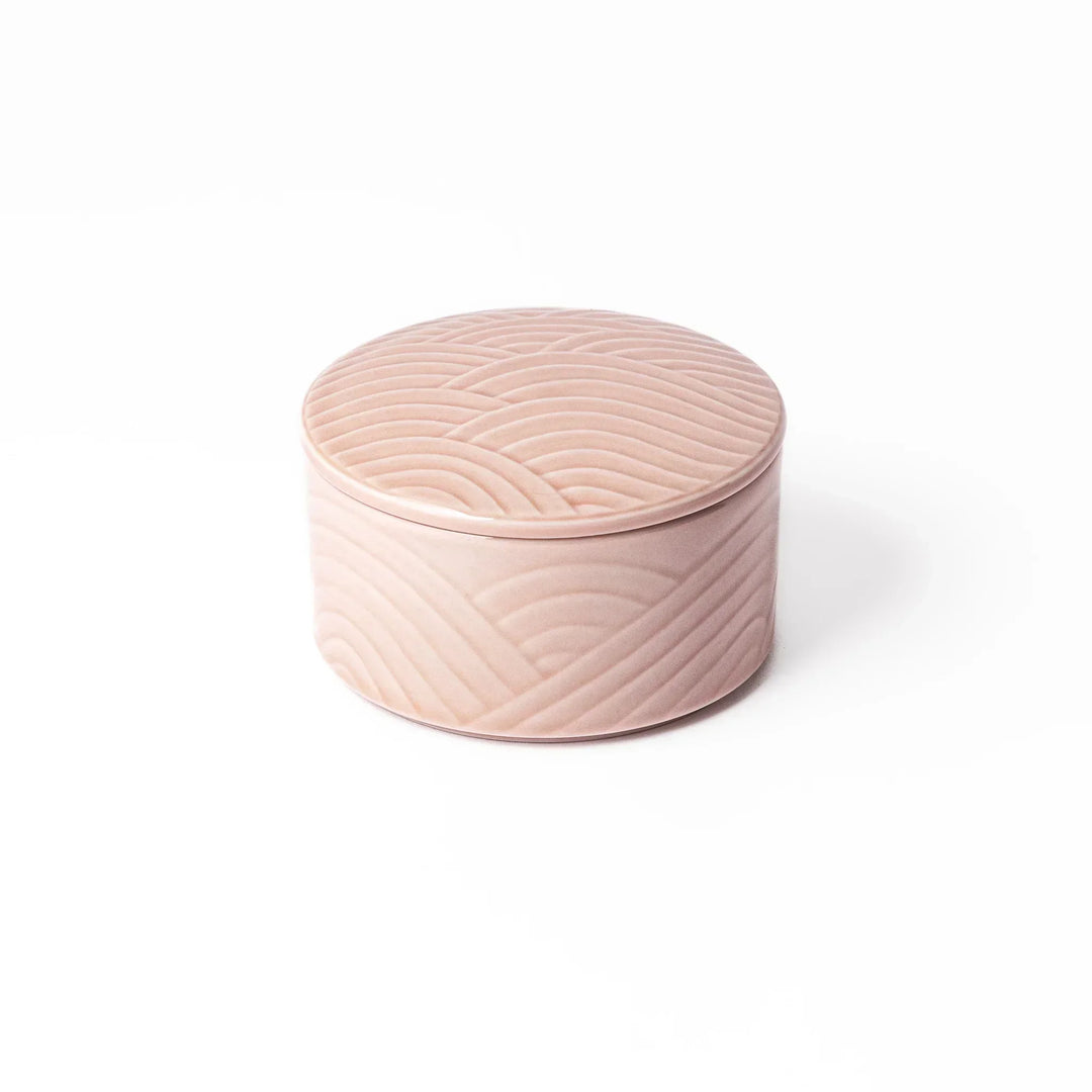 Soft pink stackable Japanese porcelain bowl with embossed Seigaiha wave pattern and modern minimalist style.