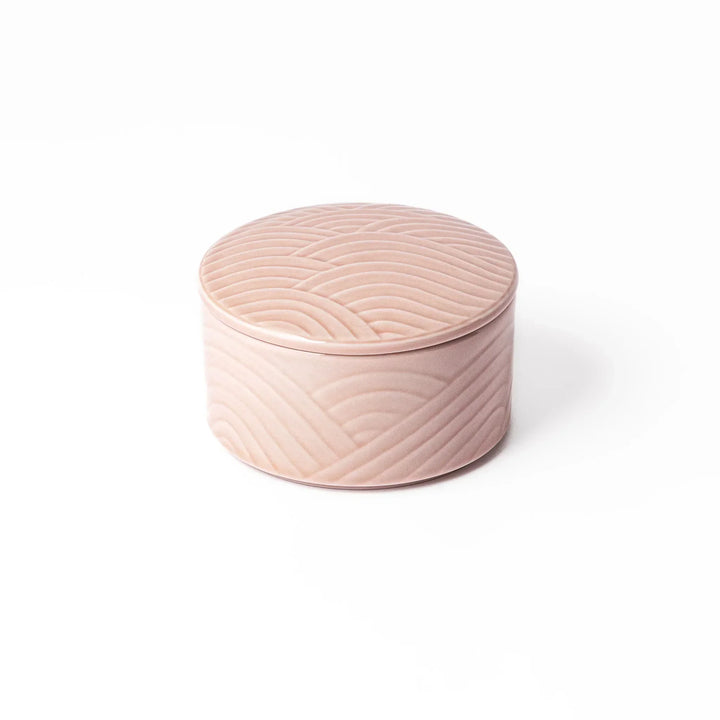 Soft pink stackable Japanese porcelain bowl with embossed Seigaiha wave pattern and modern minimalist style.