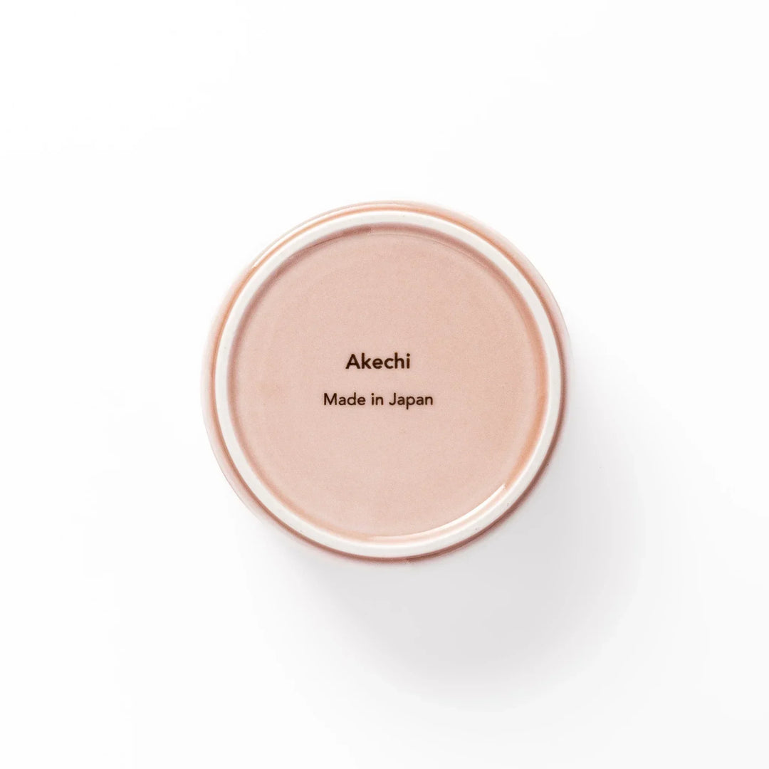 Soft pink stackable Japanese porcelain bowl with embossed Seigaiha wave pattern and modern minimalist style.