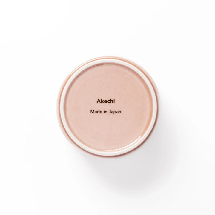 Soft pink stackable Japanese porcelain bowl with embossed Seigaiha wave pattern and modern minimalist style.