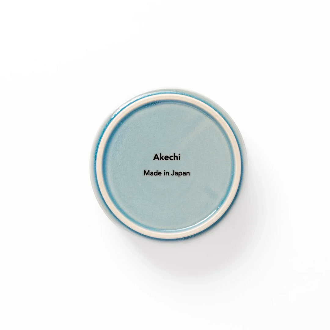 Light blue porcelain bowl embossed with a gentle Seigaiha wave pattern, showcasing a serene and minimalist Japanese design.