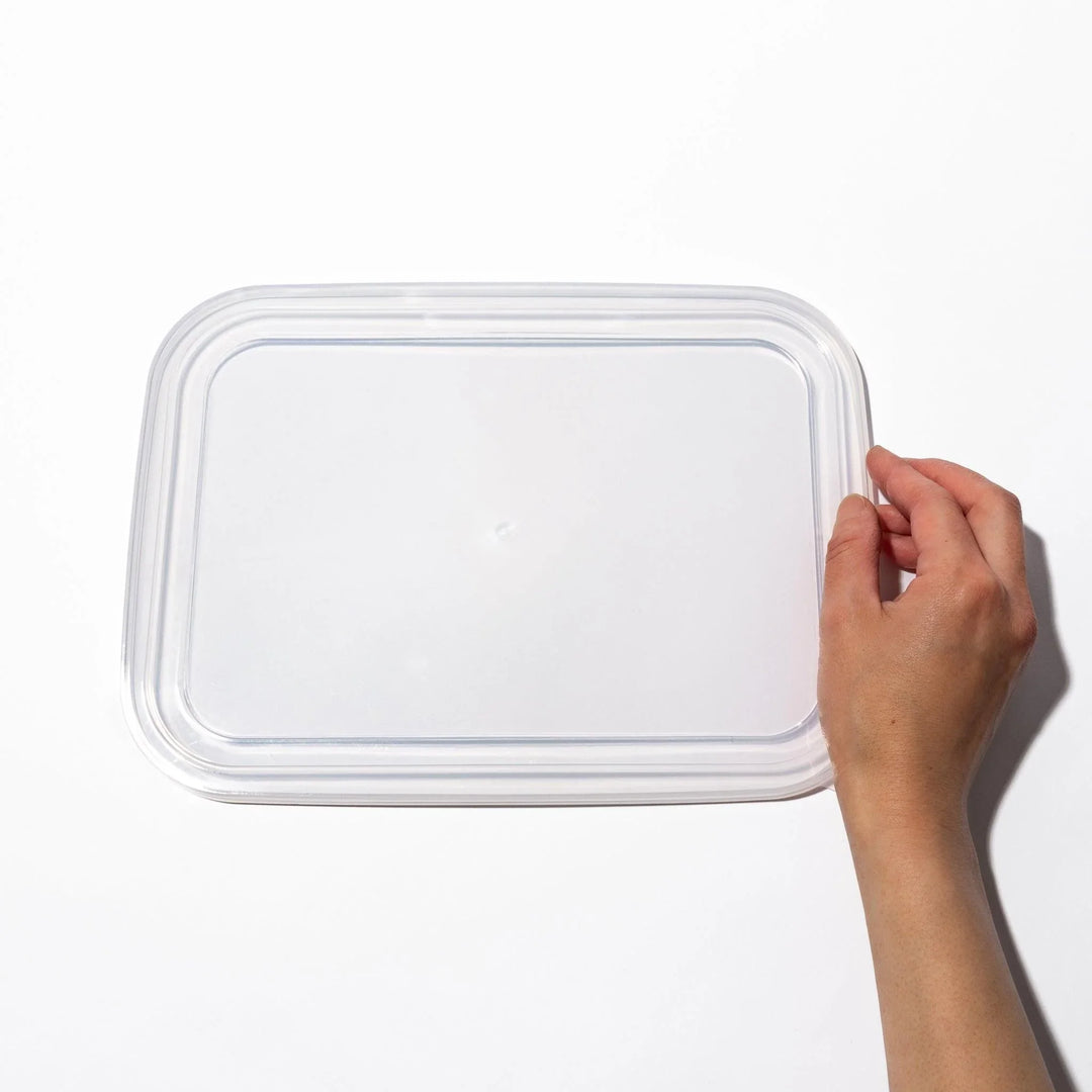 Transparent lids for stainless prep trays with snug fit and durable seal, ideal for efficient food storage.