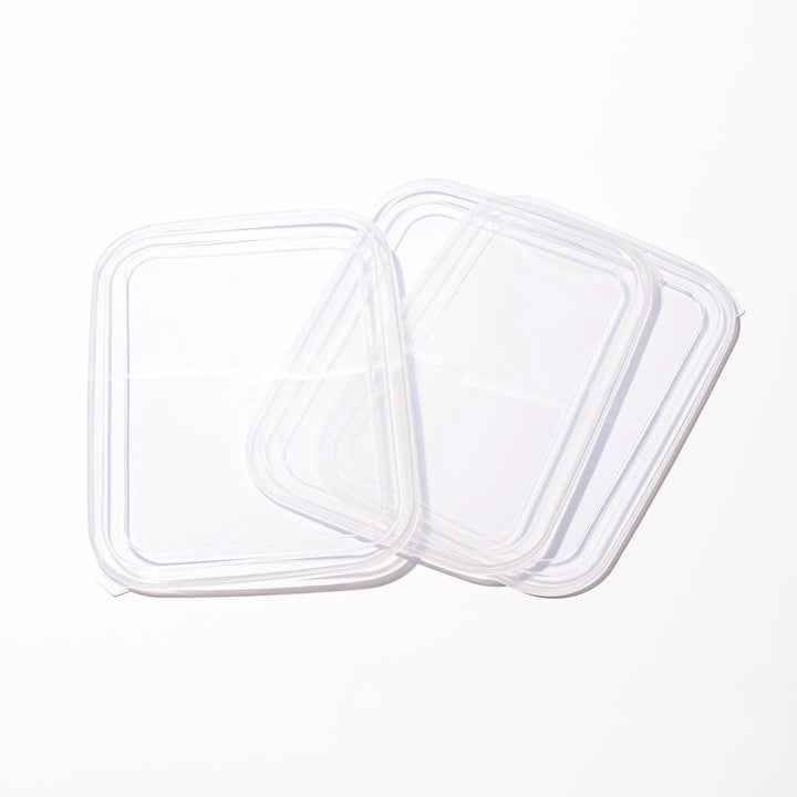 Transparent lids for stainless prep trays with snug fit and durable seal, ideal for efficient food storage.
