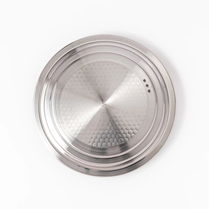 Stainless steel lid with wooden knob for Yukihira pots blending modern simplicity and Japanese craftsmanship.