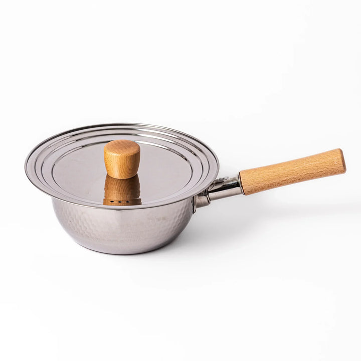 Stainless steel lid with wooden knob on Japanese yukihira pot with hammered finish and wooden handle for daily cooking