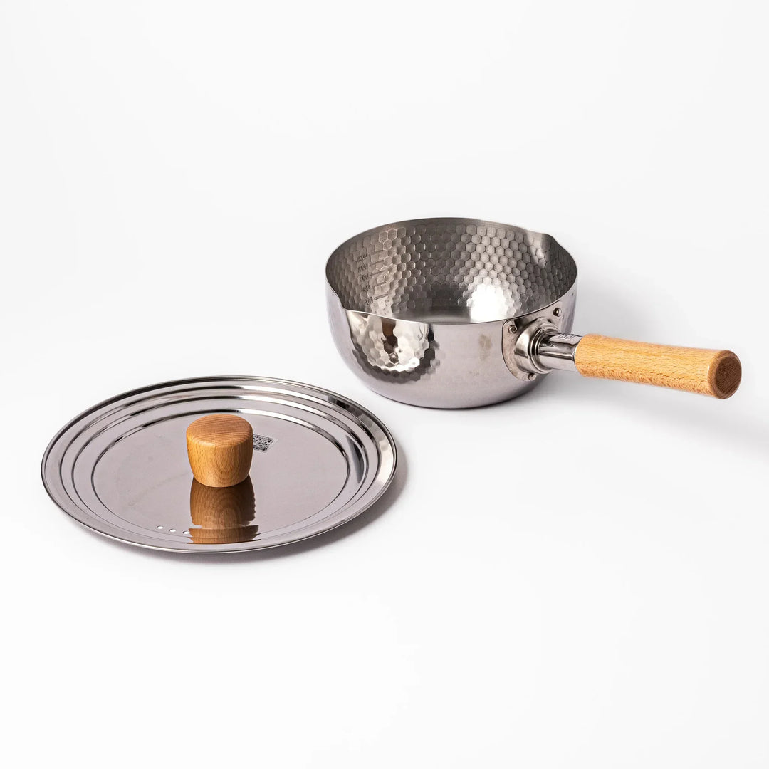 Stainless steel lid with wooden knob on Japanese yukihira pot with hammered finish and wooden handle for daily cooking