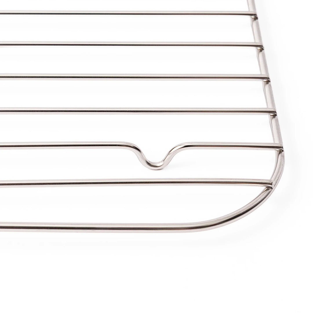 Close up of the rounded corner and raised foot on a Japanese stainless steel prep tray wire rack in large size