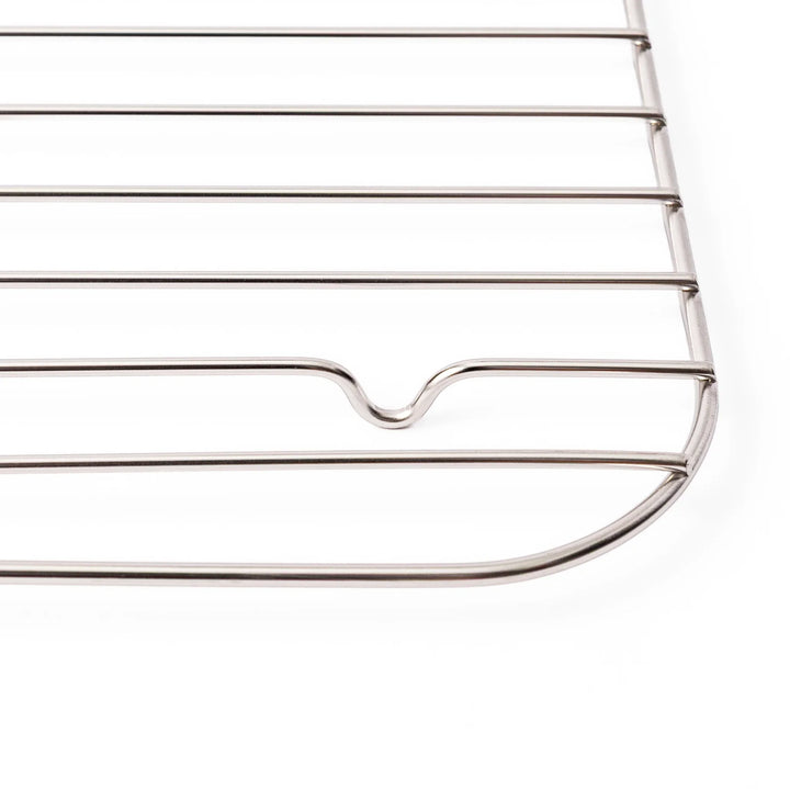 Close up of the rounded corner and raised foot on a Japanese stainless steel prep tray wire rack in large size