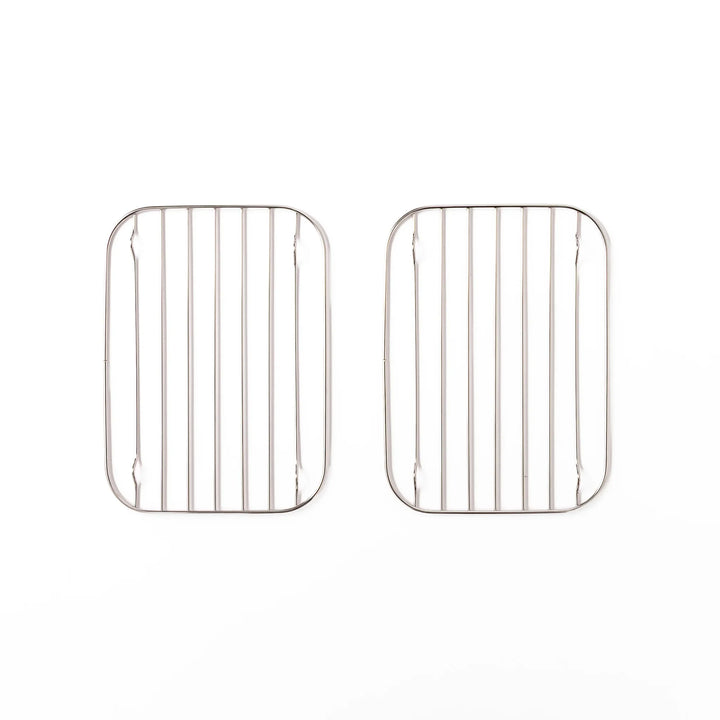 Two small Japanese stainless steel prep tray wire racks with rounded corners and raised feet