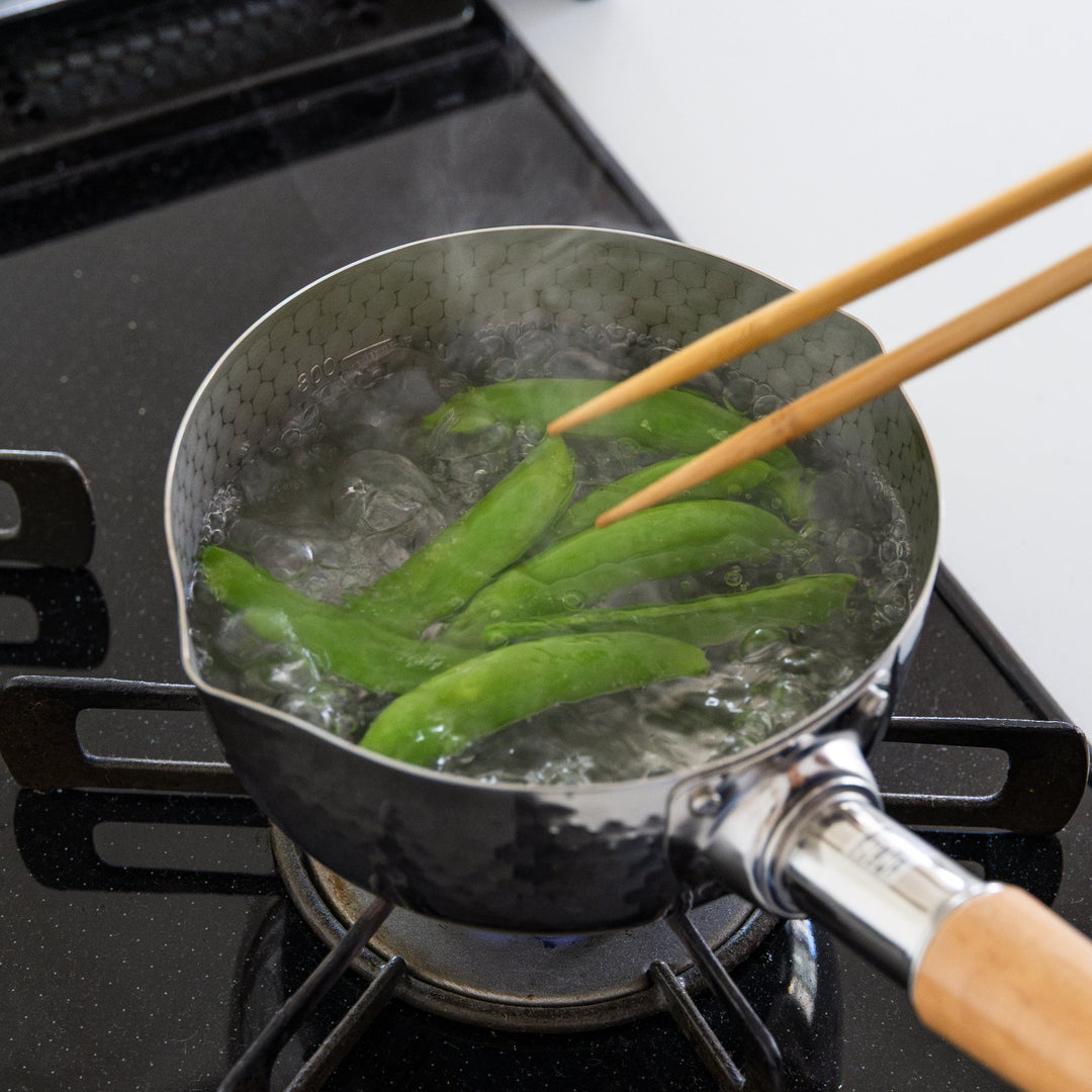Stainless Steel Yukihira Pot blanching snap peas in boiling water