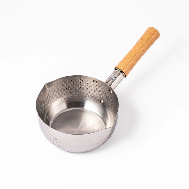 Japanese stainless steel yukihira pot with wooden handle and hammered texture, ideal for boiling soup or simmering dishes